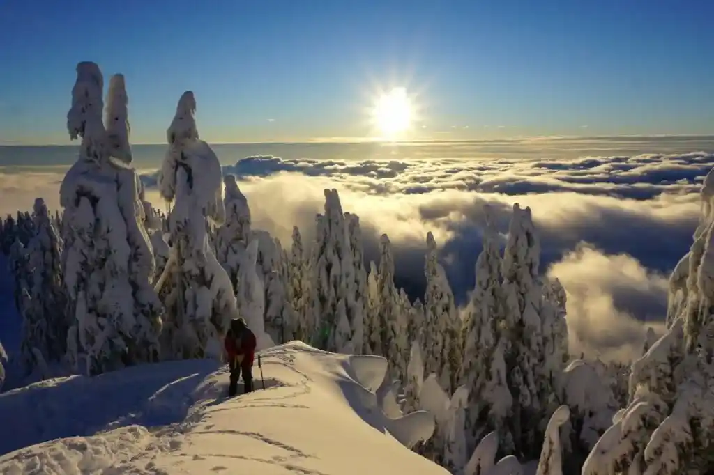 Snowshoeing on Grouse Mountain in Vancouver, BC. Find out how to have a safe and fun hike with these 8 tips for winter hiking.