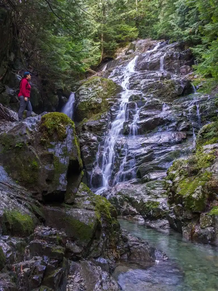 A hiker at Kennedy Falls in North Vancouver, BC
