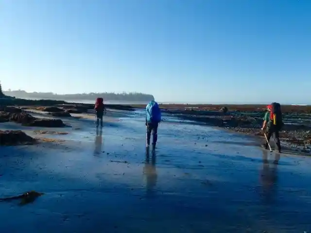 Backpackers on the beach on the Nootka Trail on Vancouver Island - one of the best backpacking trips in BC