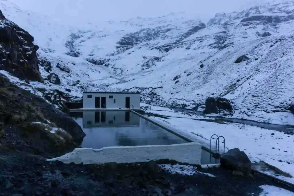 Geothermal swimming pool Seljavallalaug in winter in Iceland. A winter week in Iceland. Iceland in January. 35 Photos that will make you want to go to Iceland in winter.