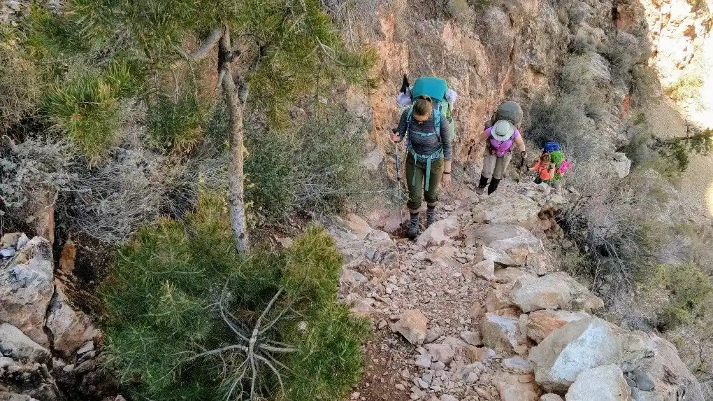 Hiking in the Grand Canyon. Get tips for hiking in the desert including what gear you need, what to wear and how to stay safe.