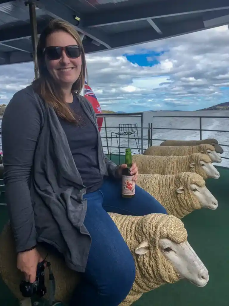You can sit on a sheep sculpture on the ferry ride to MONA