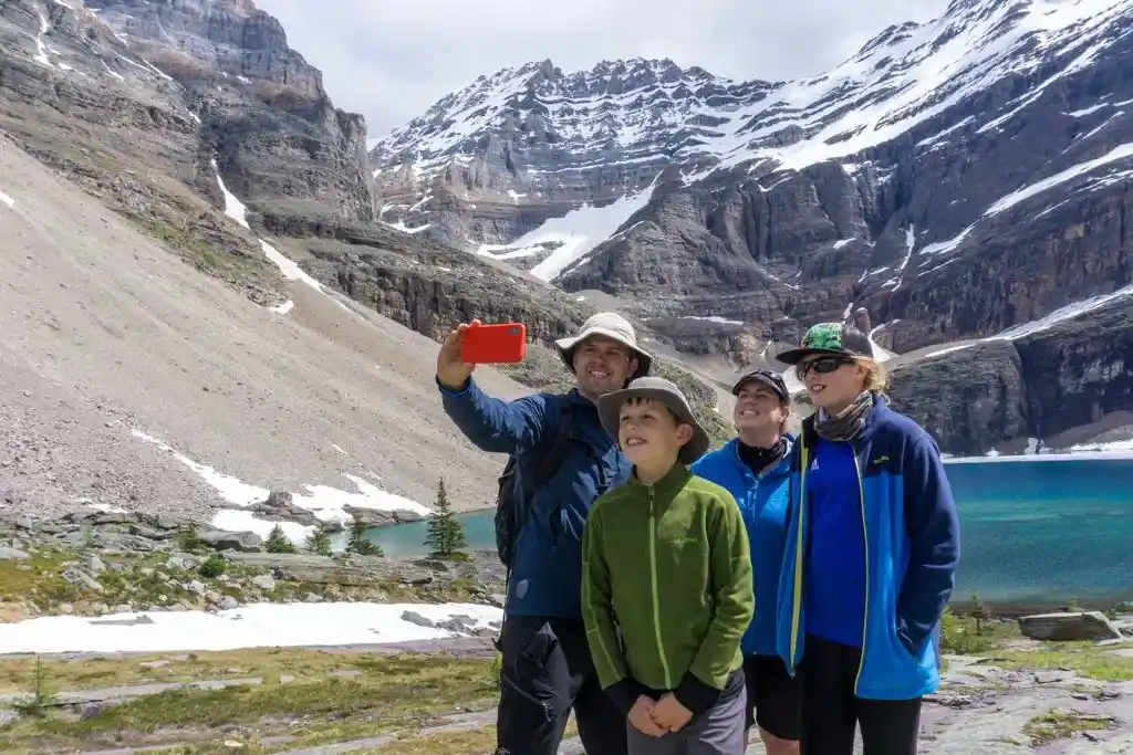 A family takes a selfie at Lake Oesa