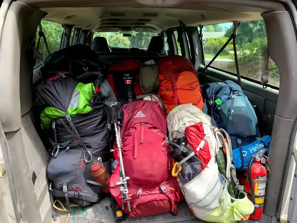 Backpacks in the back of a shuttle ready to go to the West Coast Trail. West Coast Trail Transportation. How to get to the West Coast Trail