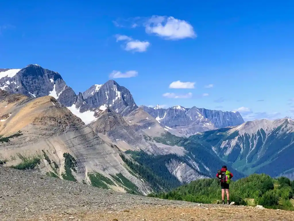 A hiker at Numa Pass on the Rockwall Trail