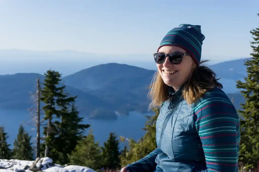 A snowshoer wearing a Merino wool beanie and Merino wool mid-layer