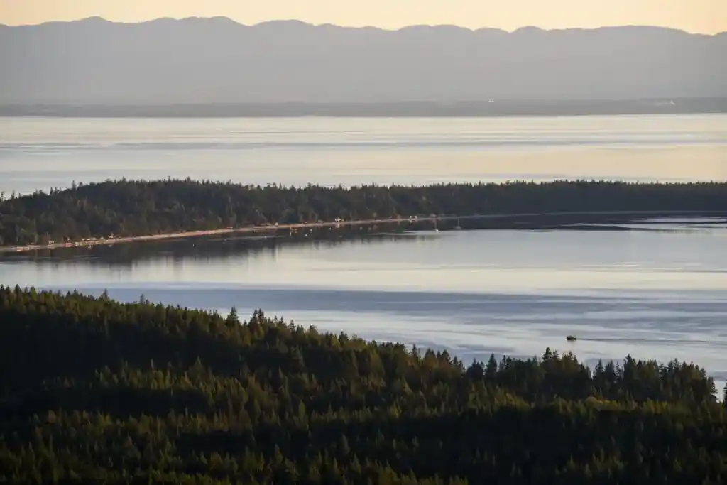 Looking down to the sandy beaches of Savary Island from Manzanita Bluff on the Sunshine Coast Trail.