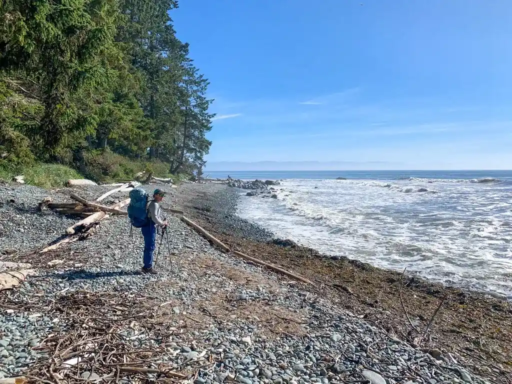A backpacker on Bear Beach on the Juan de Fuca Trail on Vancouver Island