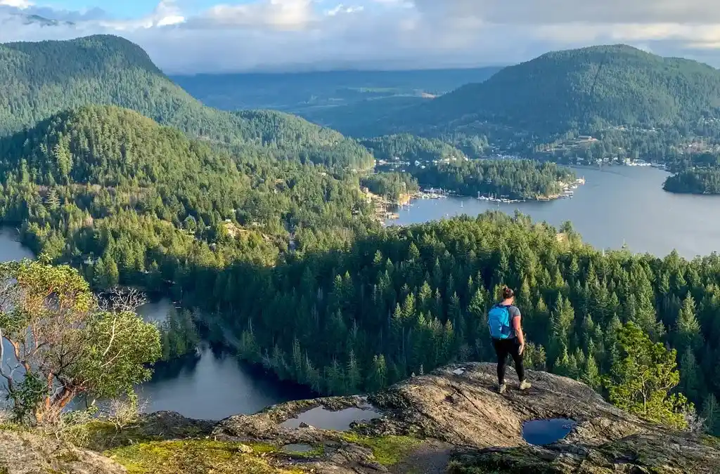 Best hiking leggings. A female hiker wearing leggings on the top of Pender Hill