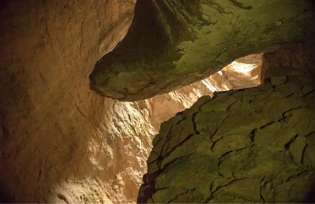 A shaft of light makes its way inside Bear Gulch Cave in Pinnacles National Park