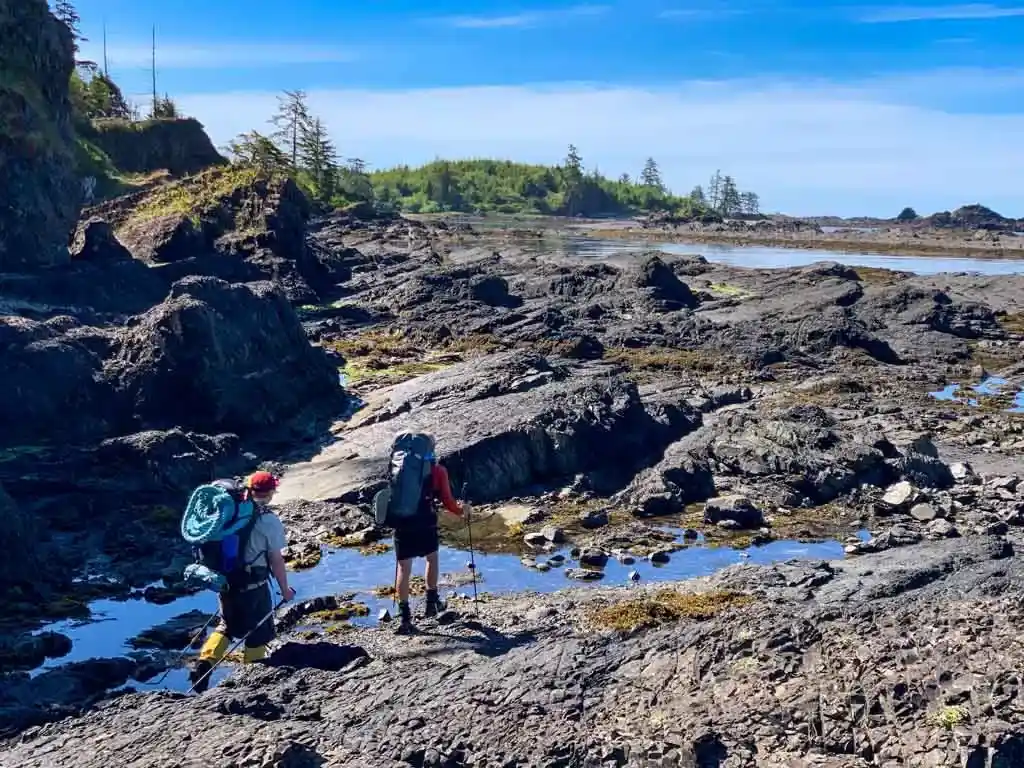 Hiking across rocks at Kapoose Point