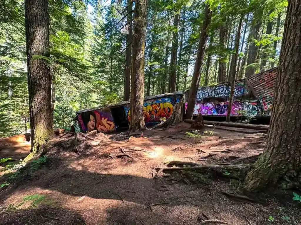 Train cars in Whistler almost falling into the river