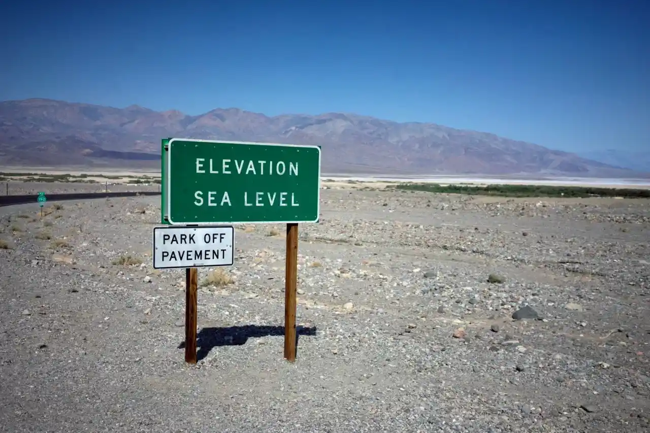 A sign reading "Elevation Sea Level" in Death Valley