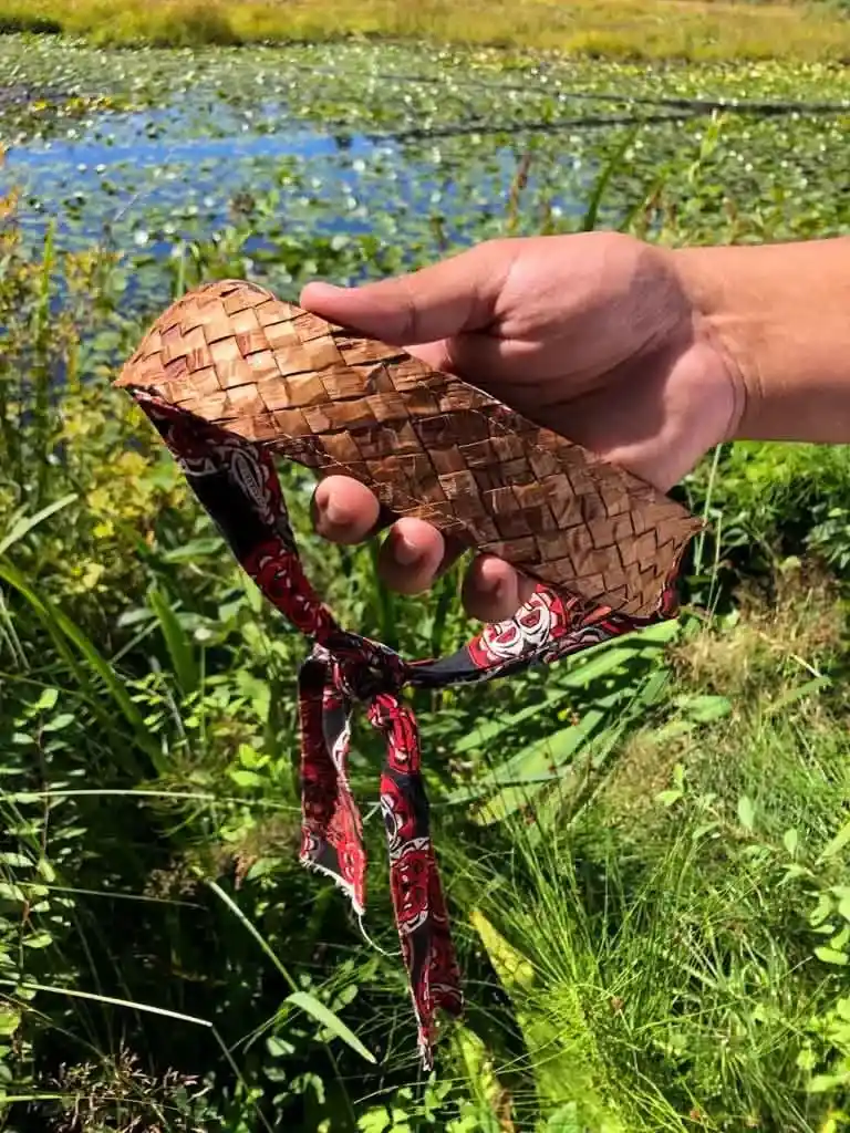 Close up of a woven cedar headband. Find out where to experience Indigenous tourism in Canada