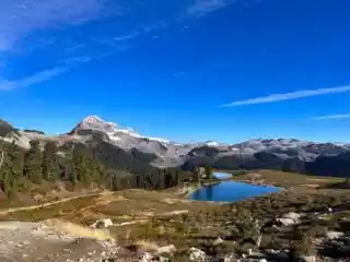 Elfin Lakes seen from the south with Mount Garibaldi/Nch'Kay, Opal Cone, and glaciers in the background. Elfin Lakes is one of the best hikes in Squamish.