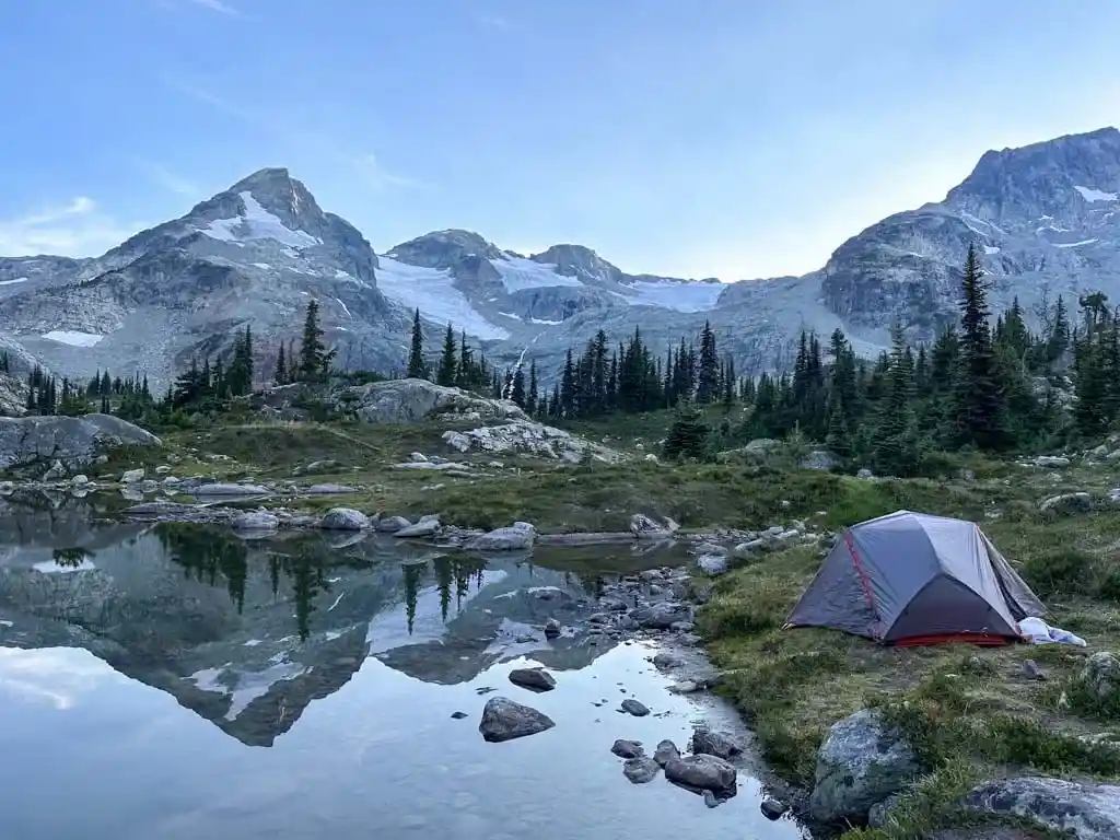 A tent next to a lake at Semaphore Lakes