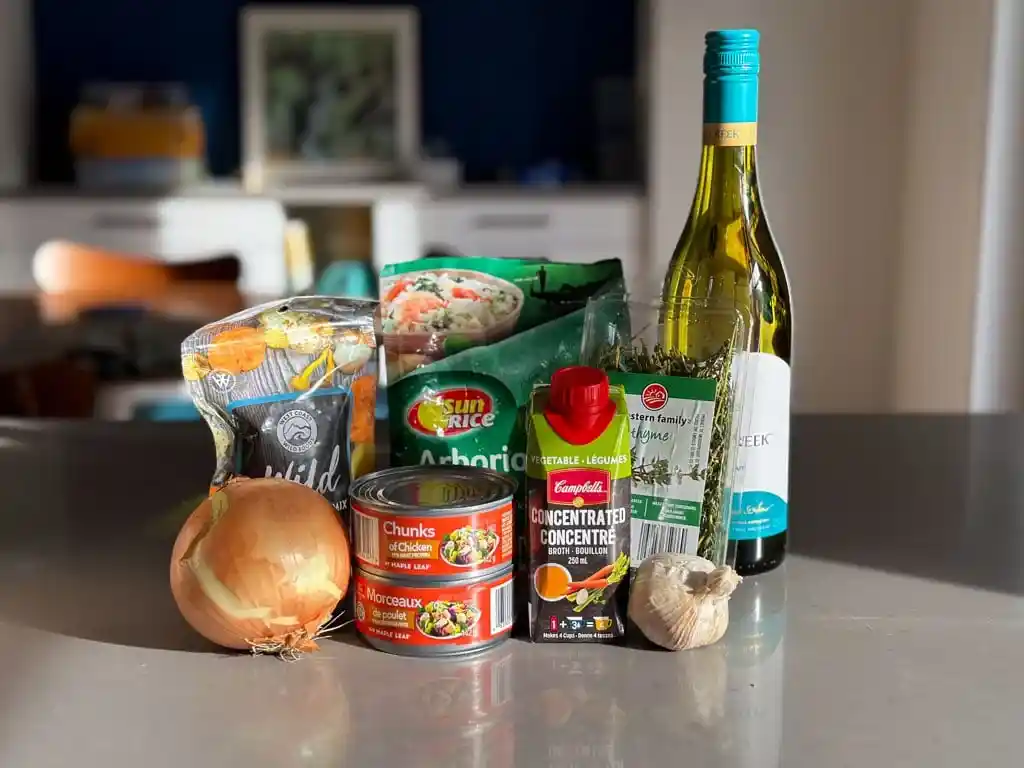 Ingredients for making dehydrated mushroom risotto are grouped together on a kitchen counter. 