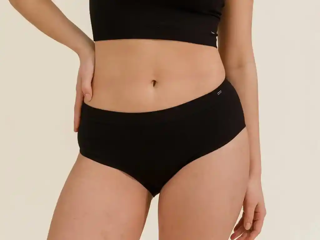 A model wearing the Branwyn Essential hipster merino wool underwear for hiking. 