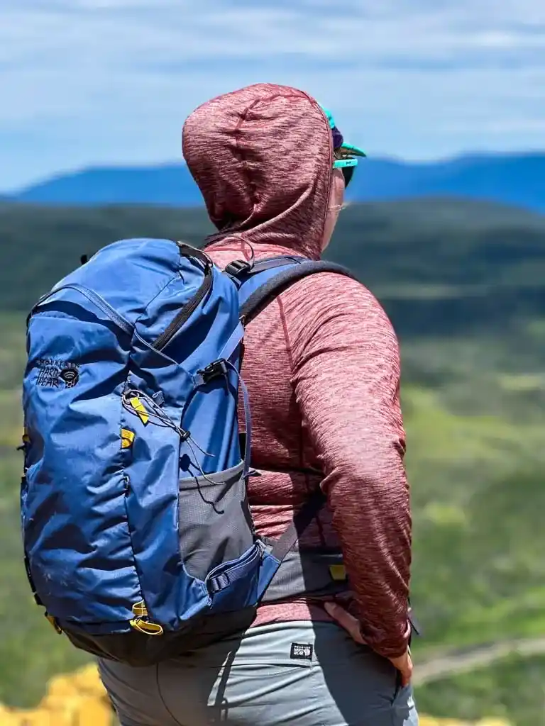 A woman wearing a sun hoodie in hot weather