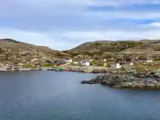 A group of fishermen's shacks along the coast on Fogo Island, Newfoundland - there are so many things to do on Fogo Island