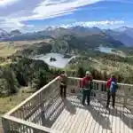 Hikers enjoy the views from the Standish Viewing Deck at Sunshine Meadows