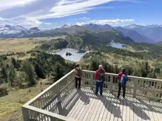 Hikers enjoy the views from the Standish Viewing Deck at Sunshine Meadows