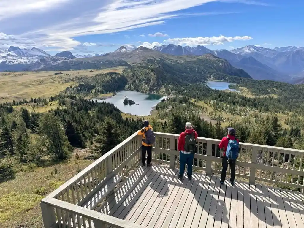 Hikers enjoy the views from the Standish Viewing Deck at Sunshine Meadows
