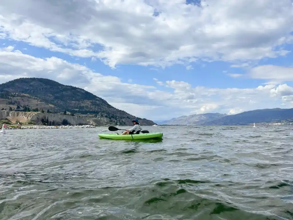 A woman kayaking on Okanagan Lake in Penticton