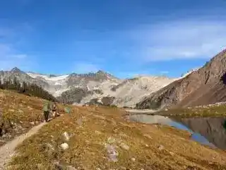 Two hikers walking along the trail to Russet Lake near Whistler